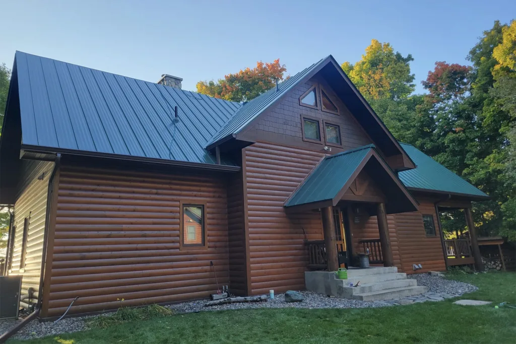 Green Metal Roof On House In The Fall